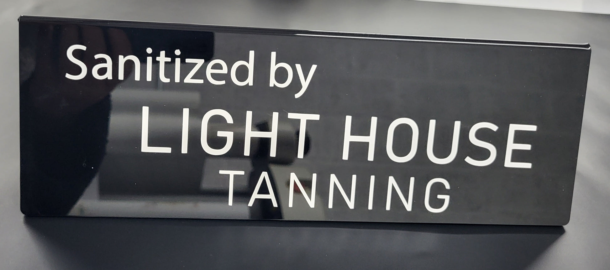 Sanitised by A folded sign